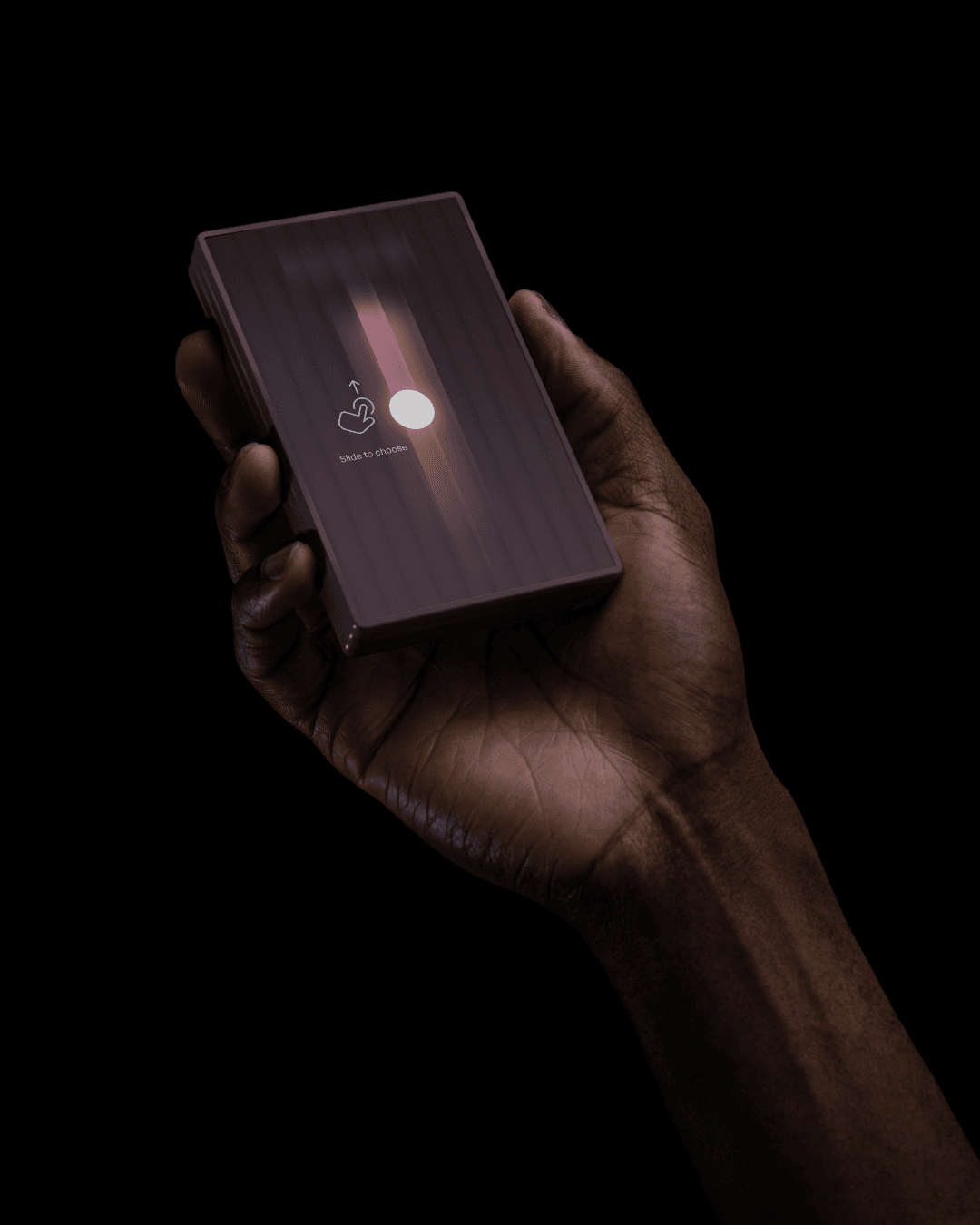 A hand holds a rectangular dark electronic device with a glowing interface. The screen shows a finger icon with an arrow pointing up, and a circular white button, set against a vertically striped background.